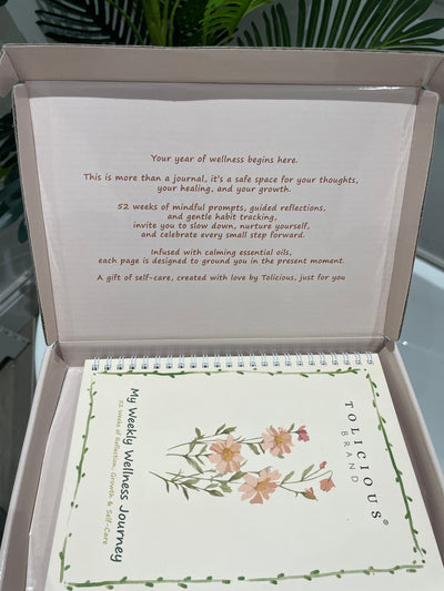 Tolicious Brand essential oil infused journal with floral cover and guided wellness prompts inside a gift box