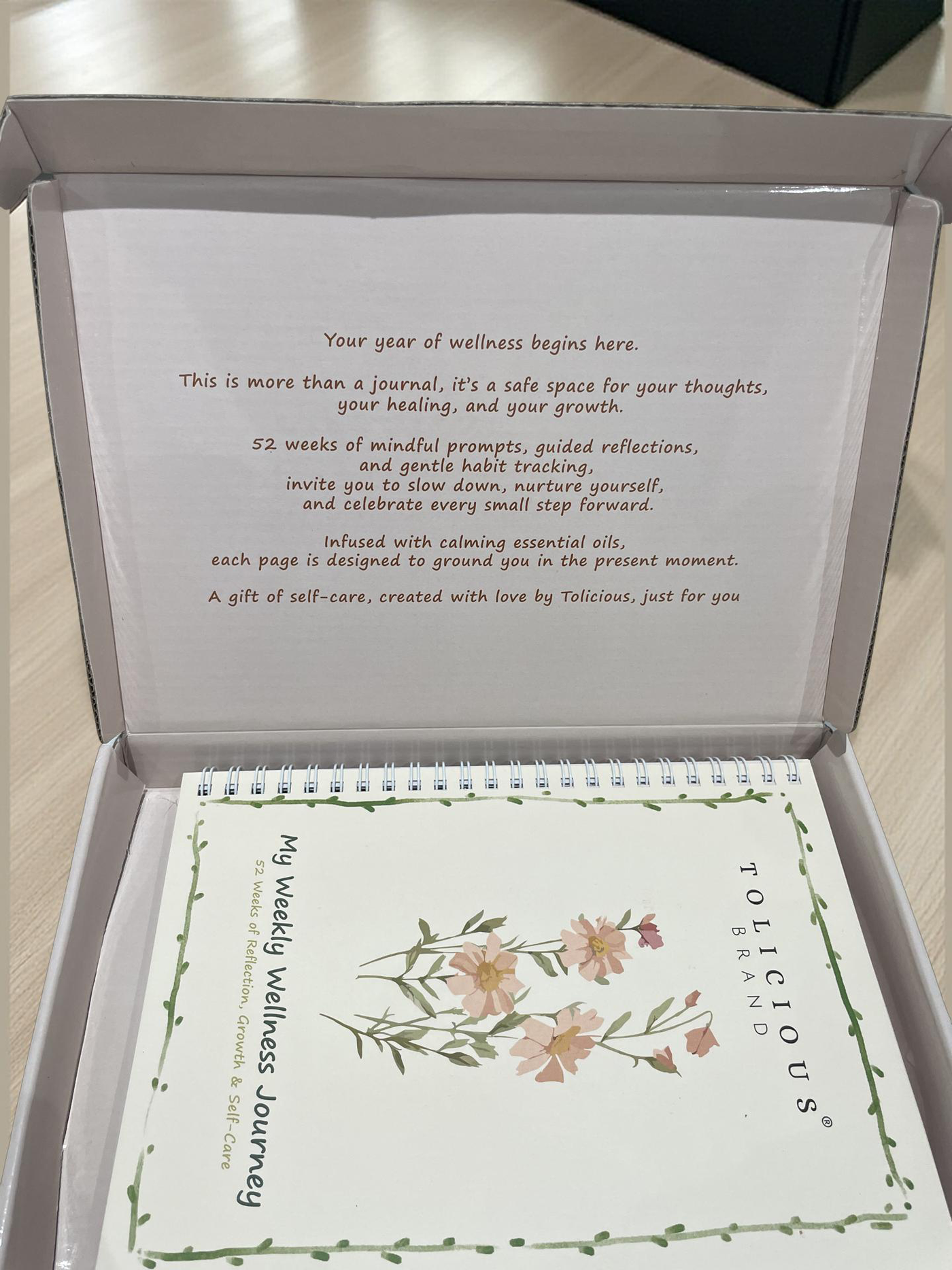 Tolicious Brand essential oil infused journal with floral cover and wellness prompts for mindful reflection