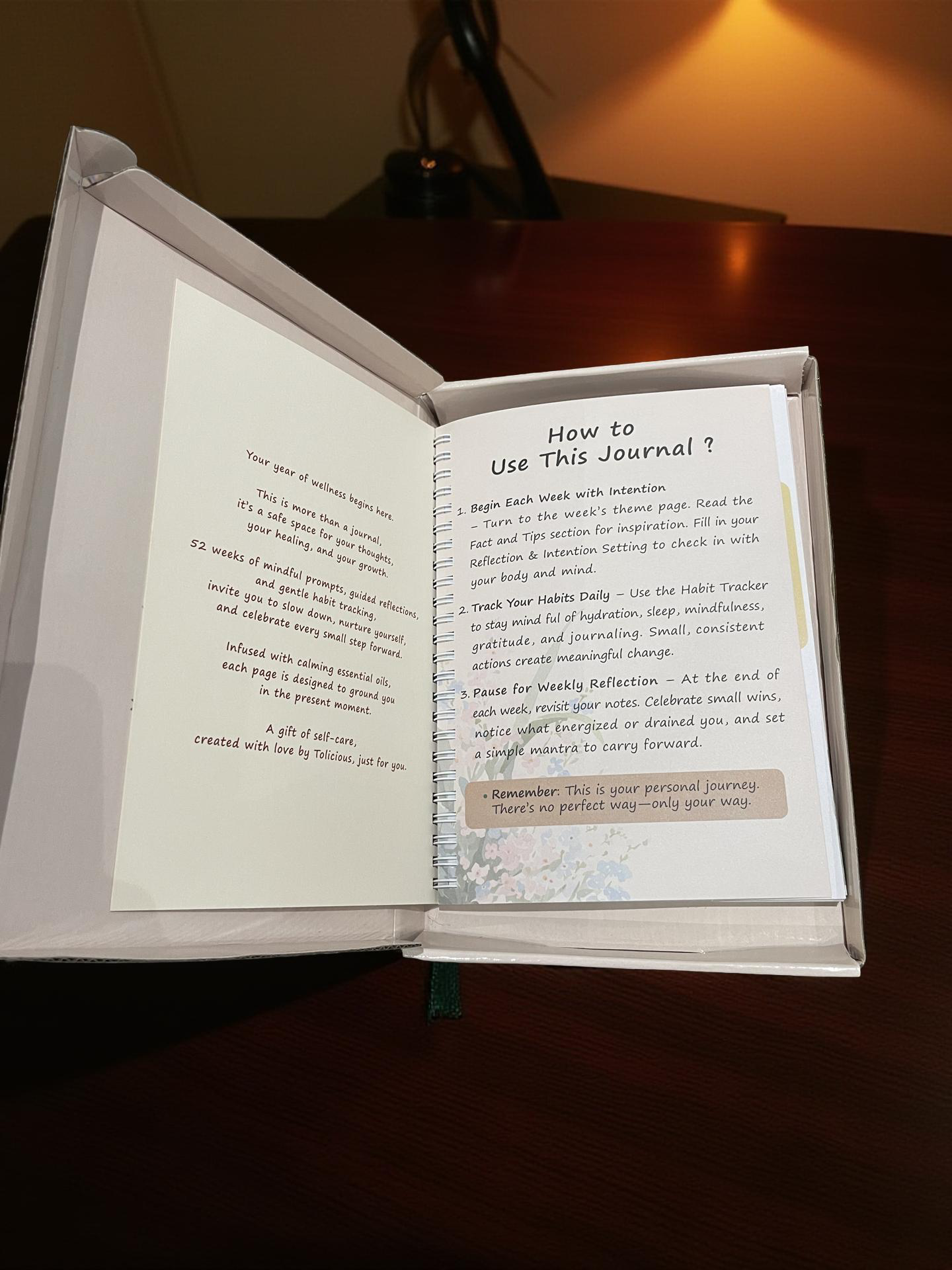 Open essential oil infused journal by Tolicious Brand showing instructions on how to use the journal