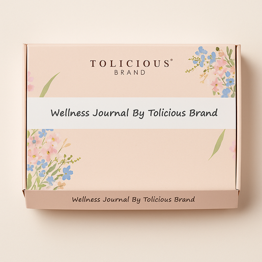 Tolicious Brand essential oil infused journal wellness box with floral design on soft pink background