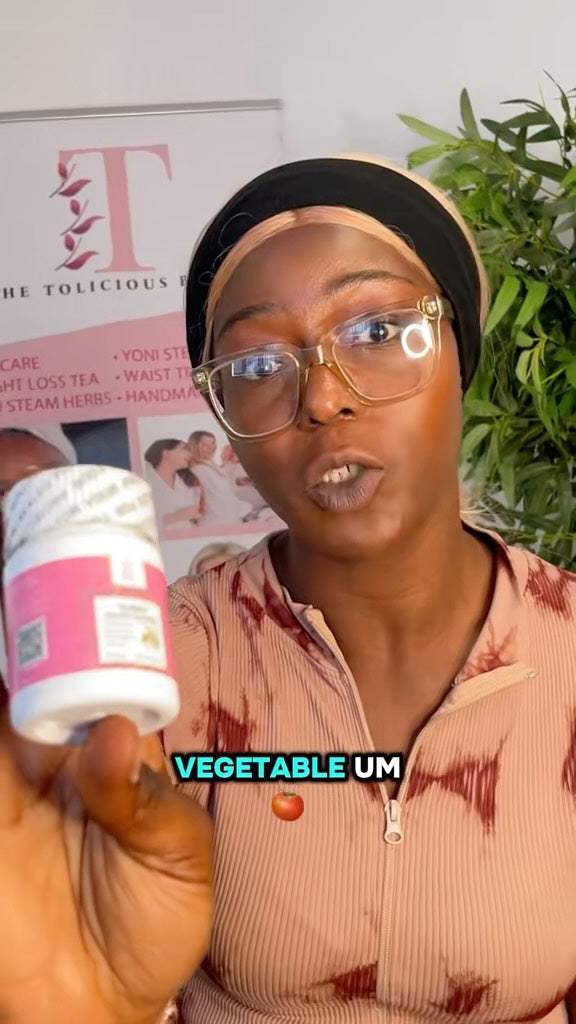 Woman holding a Tolicious Brand wellness tea and detox gummies pack bottle in front of promotional banner
